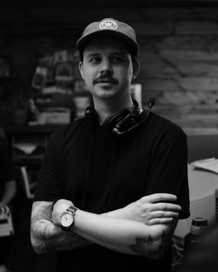 Tyler Duplechin on set, wearing a headset